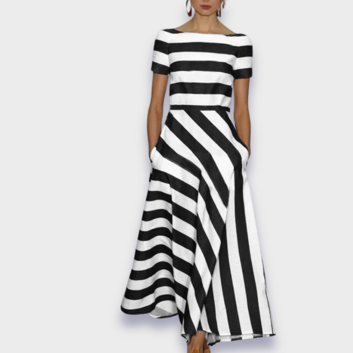 Elegant women's striped A-line midi dress. Casual yet chic, ideal for summer fashion. Effortless, comfortable, flattering.