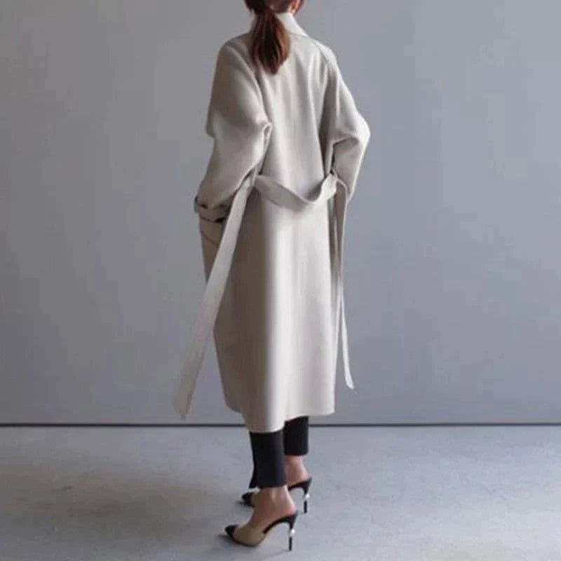 Elegant women's warm winter coat, perfect for fall and winter fashion. Stylish long outerwear for office or casual wear.
