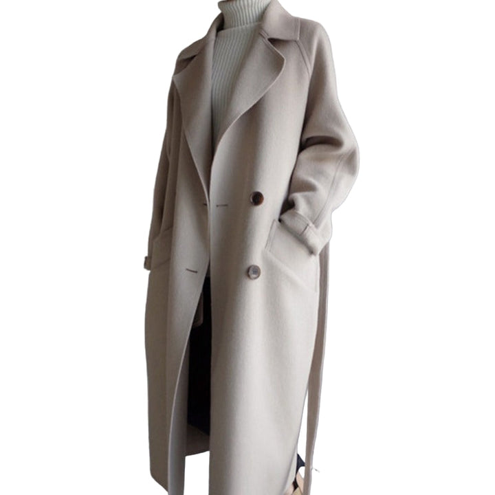 Fashionable brown women's elegant winter coat. Warm long outerwear, ideal for fall and winter fashion, office & casual.