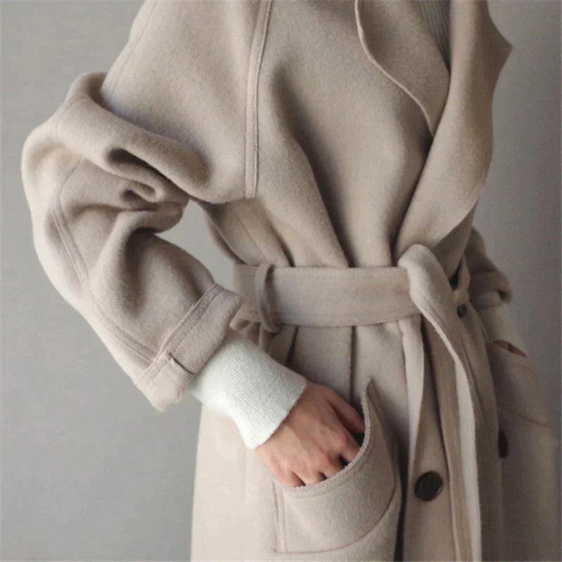 Warm women's elegant long winter coat, essential fall fashion outerwear. Perfect for keeping cozy during winter office wear.