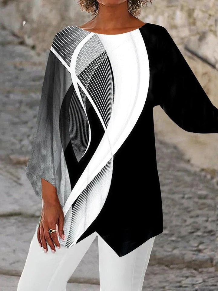 Comfortable women's geometric long sleeve tunic. Versatile black & white abstract style, perfect for casual or evening wear.