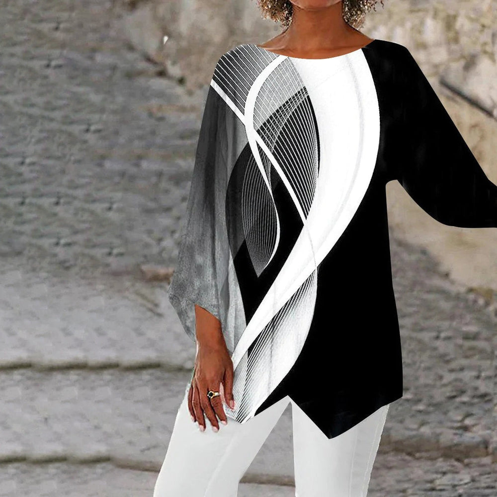 Women's stylish geometric long sleeve tunic with black & white abstract print and asymmetrical hem, modern fashion.
