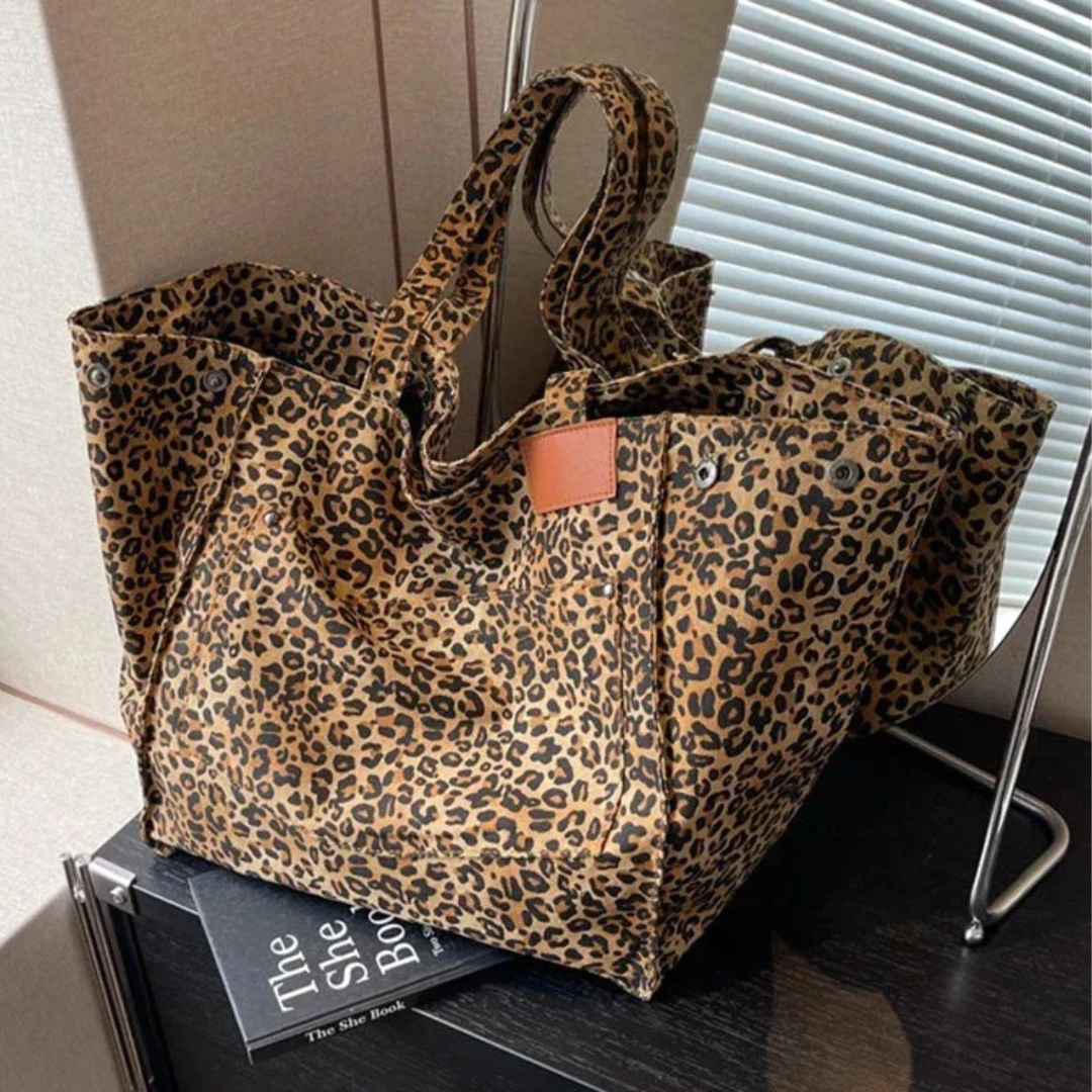 Spacious women's leopard print handbag, a chic and stylish purse perfect for modern fashionistas.