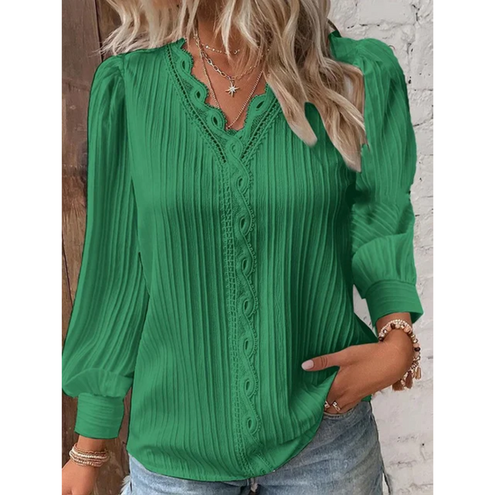 Fashionable V-neck long sleeve blouse for women. Elegant button-up shirt, perfect for stylish everyday wear.