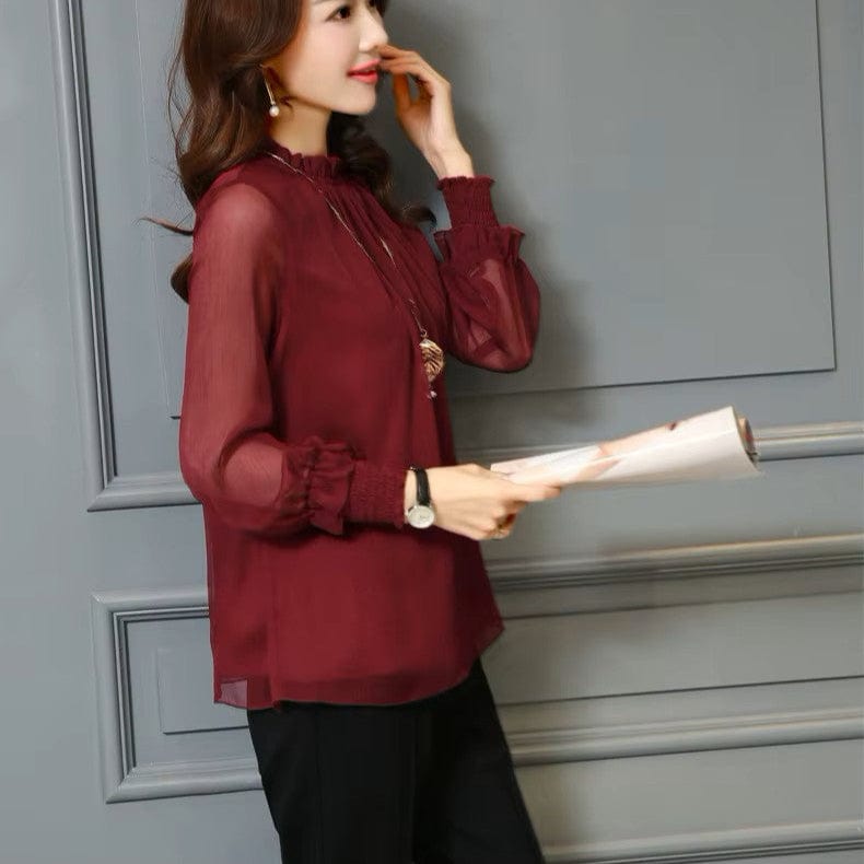Stylish women's chiffon blouse featuring delicate ruffles & transparent puff sleeves. Casual or elegant.