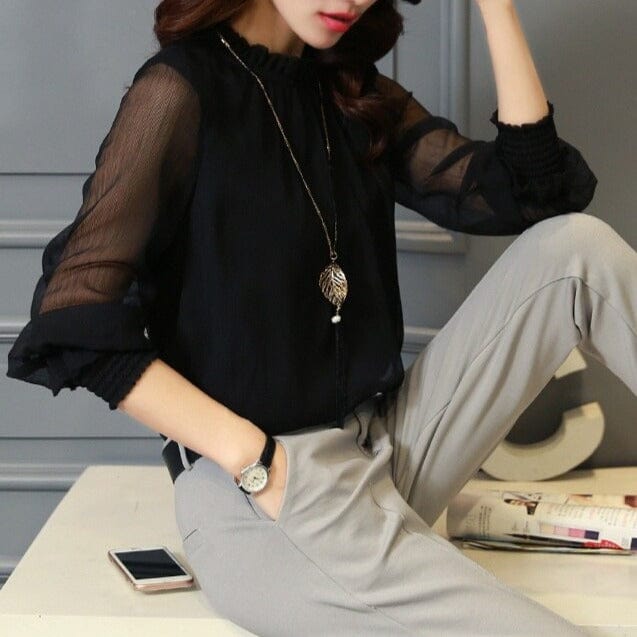 Elegant women's ruffled blouse with sheer puff sleeves. Perfect for stylish workwear or an evening out.