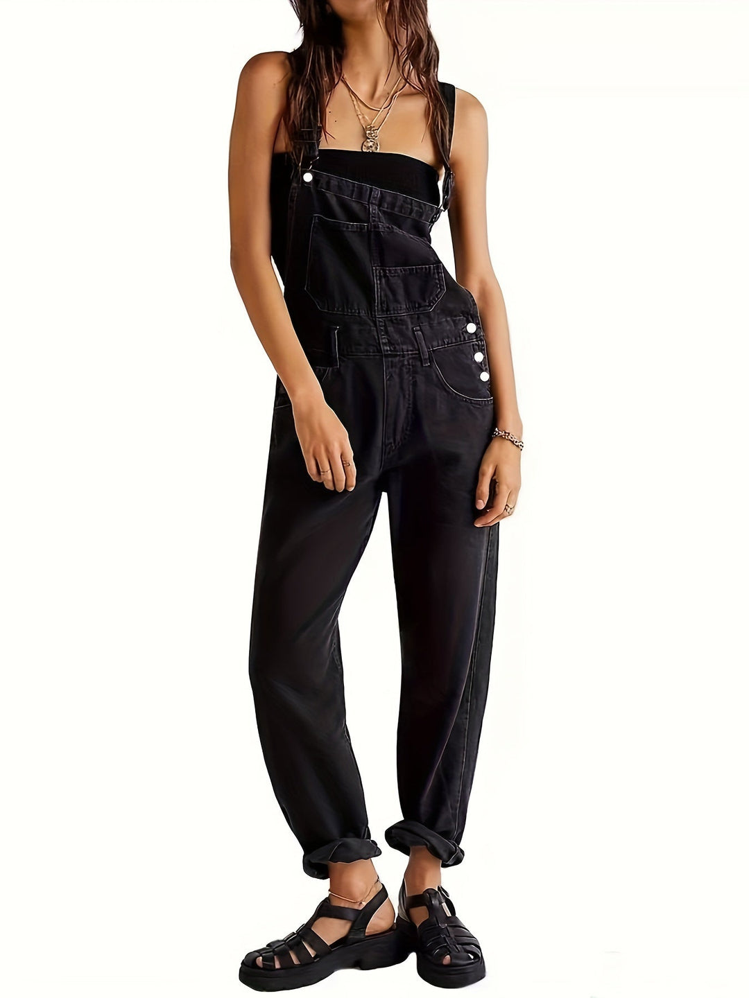 Versatile women's denim jumpsuit, ideal as a stylish spring outfit or comfortable summer romper.