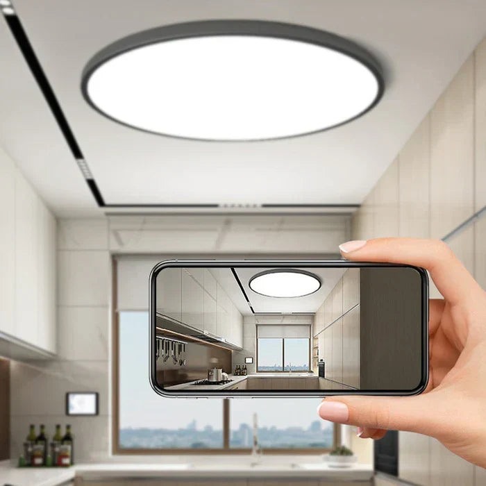 Sleek round LED ceiling lamp for modern homes. Enhances decor in living rooms and bedrooms.