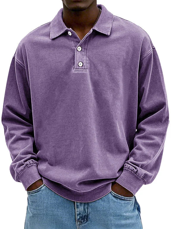 Close-up of the fabric texture on a men's classic long-sleeved polo, highlighting quality and comfort.