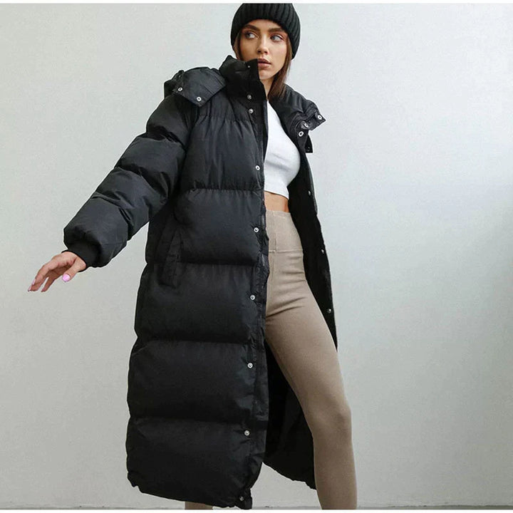 Chic women's long puffer coat, Elise, ideal for stylish winter fashion. Warm down jacket for everyday wear.