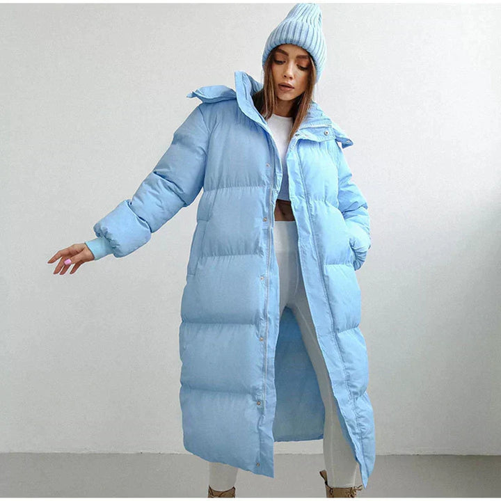 Stylish women's long puffer coat, Elise, for winter warmth. Cozy and chic down jacket, perfect for cold weather.
