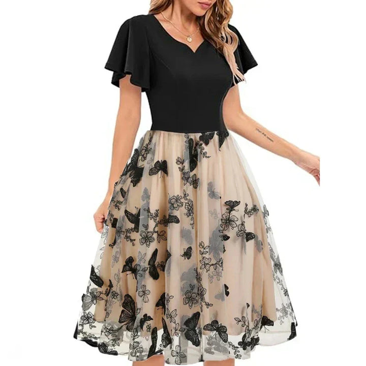 Stunning party A-line midi dress for women featuring delicate butterfly embroidery, perfect for special occasions.