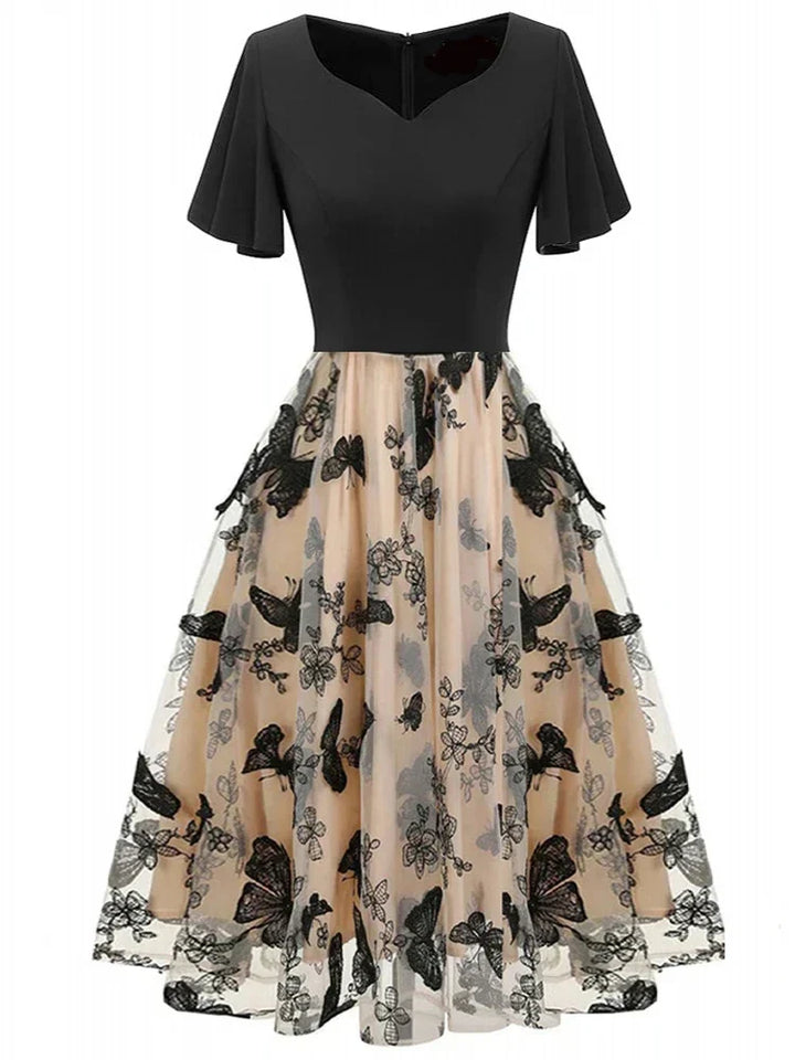 Elegant women's A-line midi dress with intricate butterfly embroidery, short sleeve, and scoop neck.