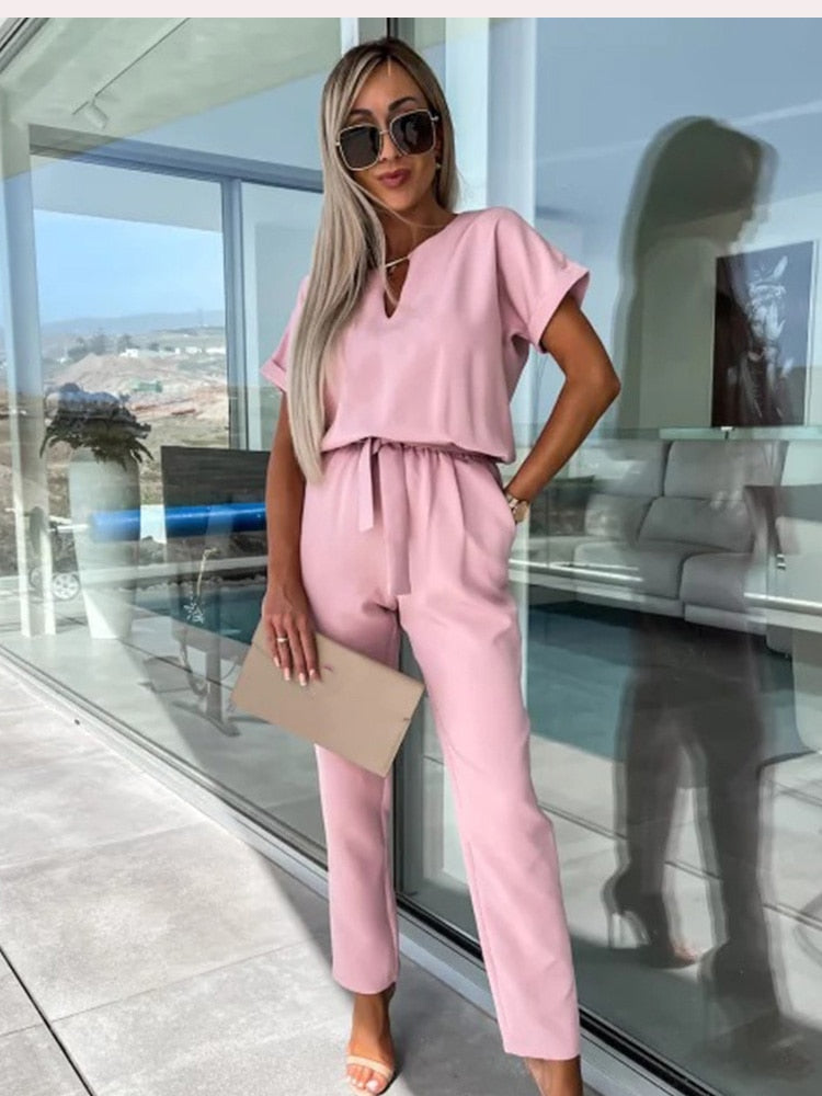 Chic summer women's wide leg jumpsuit, offering a comfortable and elegant V-neck style for any event.