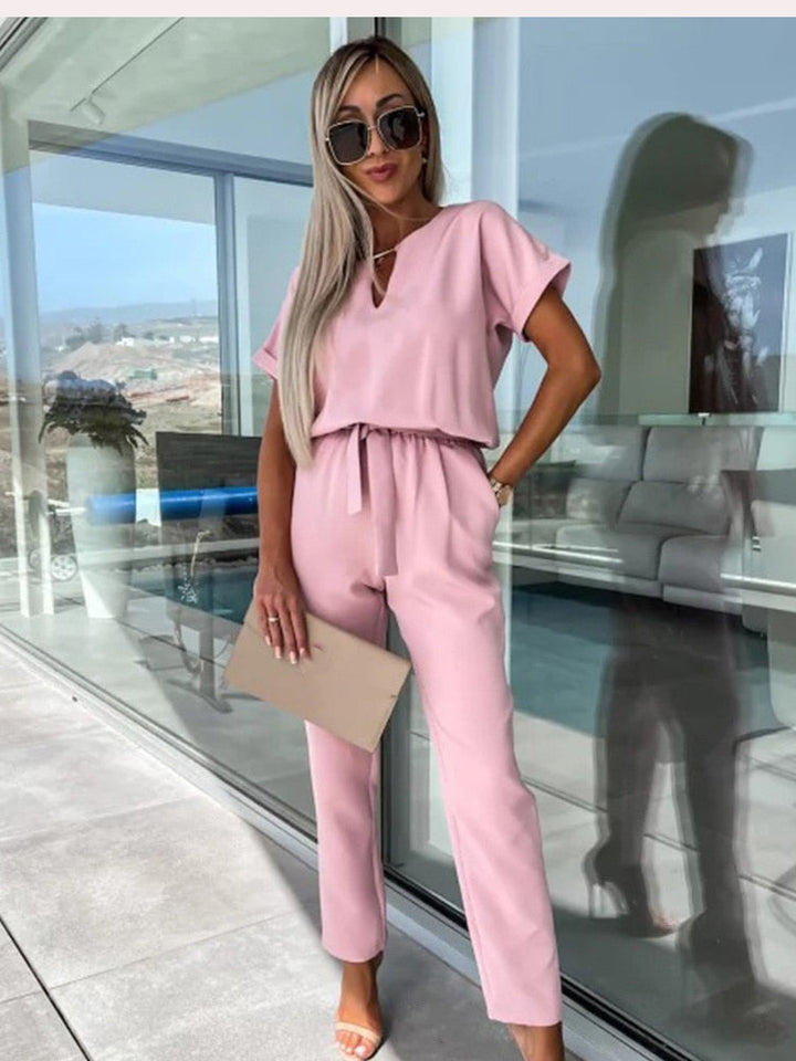 Chic summer women's wide leg jumpsuit, offering a comfortable and elegant V-neck style for any event.
