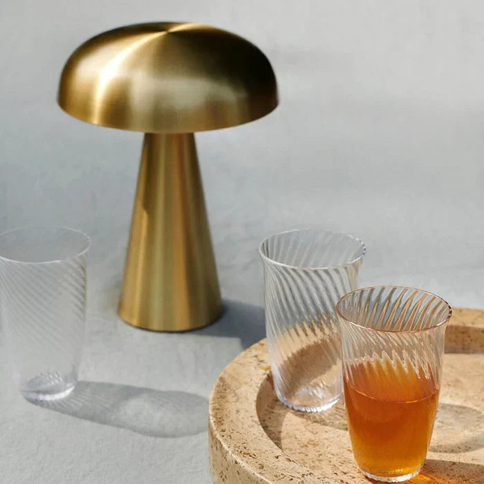 Modern ShroomLite LED table lamp, sleek gold finish, elegant home decor and mood lighting.
