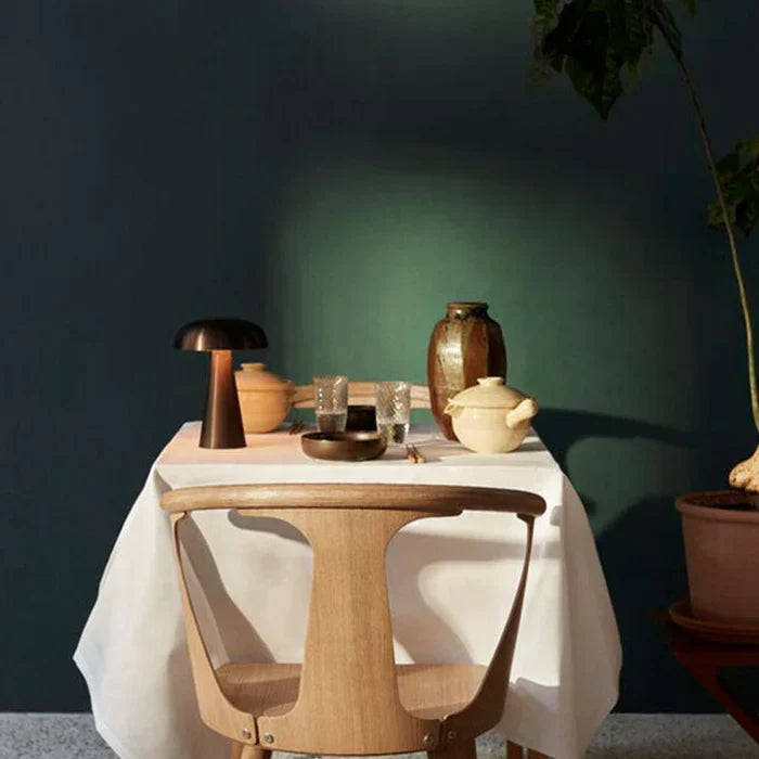 Bronze finish ShroomLite portable LED lamp, rechargeable, creates warm, inviting mood lighting.