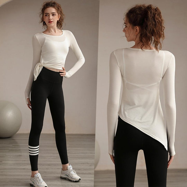 High-waist leggings and long-sleeve workout top. Women's gym clothes set with tummy control for yoga.