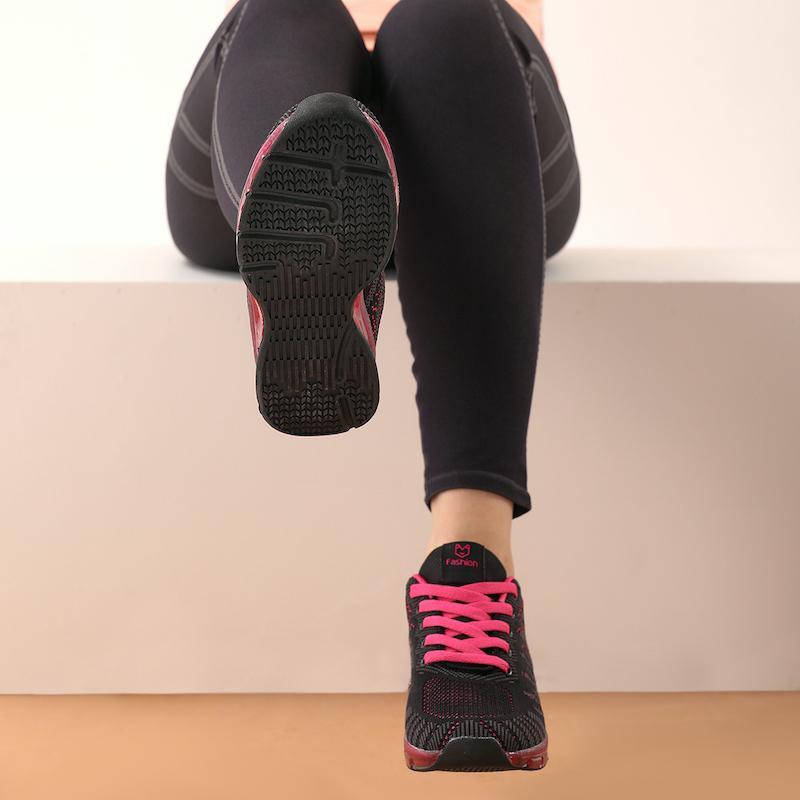 Breathable navy women's athletic sneakers, lightweight design for comfortable walking & casual wear.