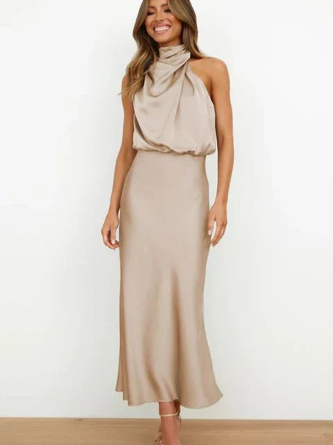 Flowy sleeveless maxi evening dress for women, ideal for summer parties & wedding guests.