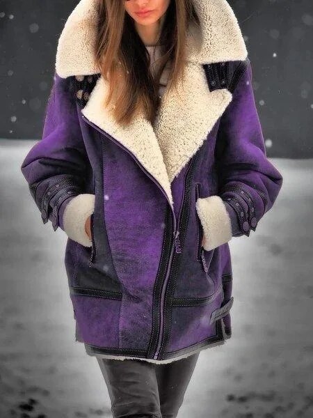 Fashionable women's Mila suede Sherpa jacket, an essential chic outerwear piece for stylish fall and winter days.
