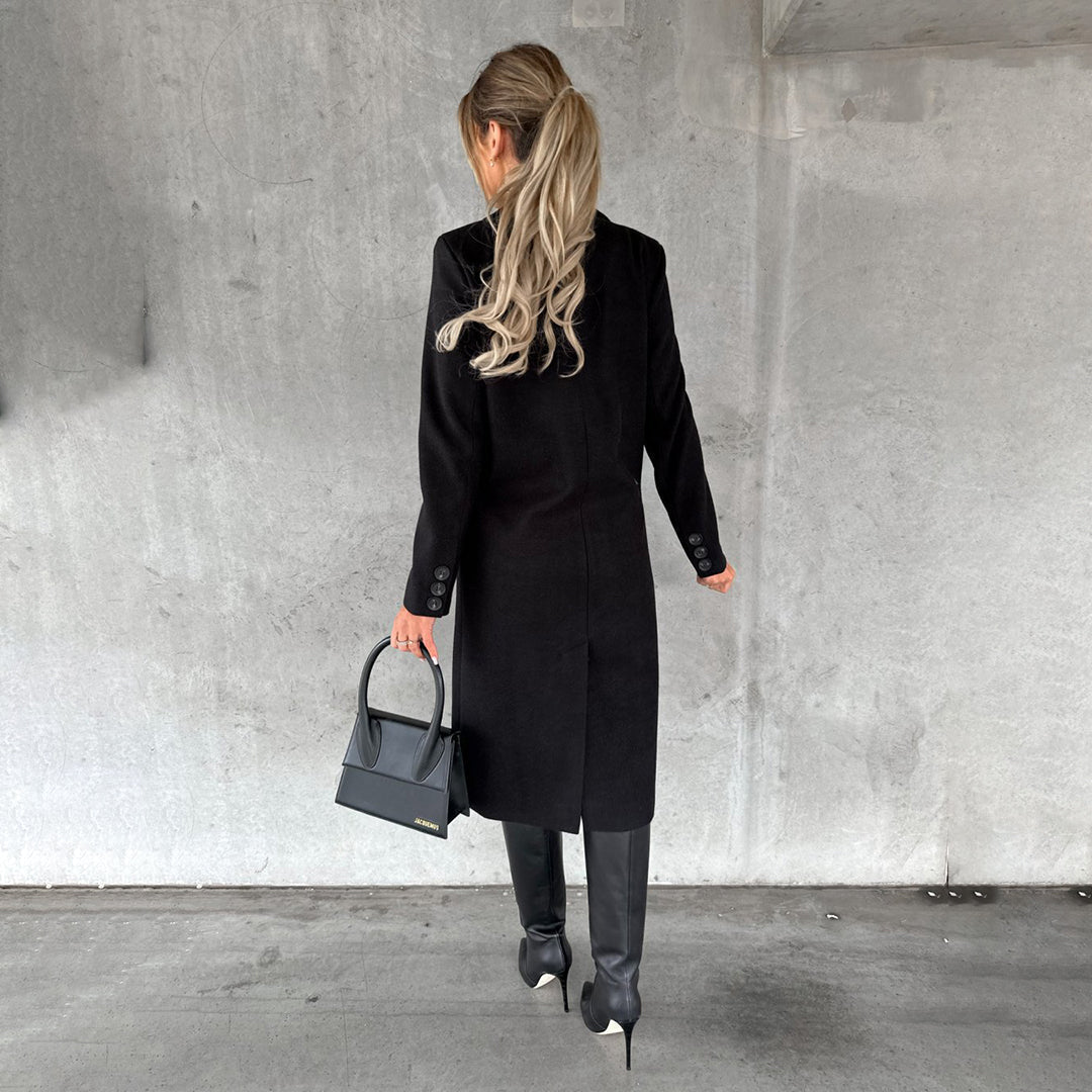 Back view of Elara long winter coat. Stylish and warm women's outerwear, perfect for cold weather days.