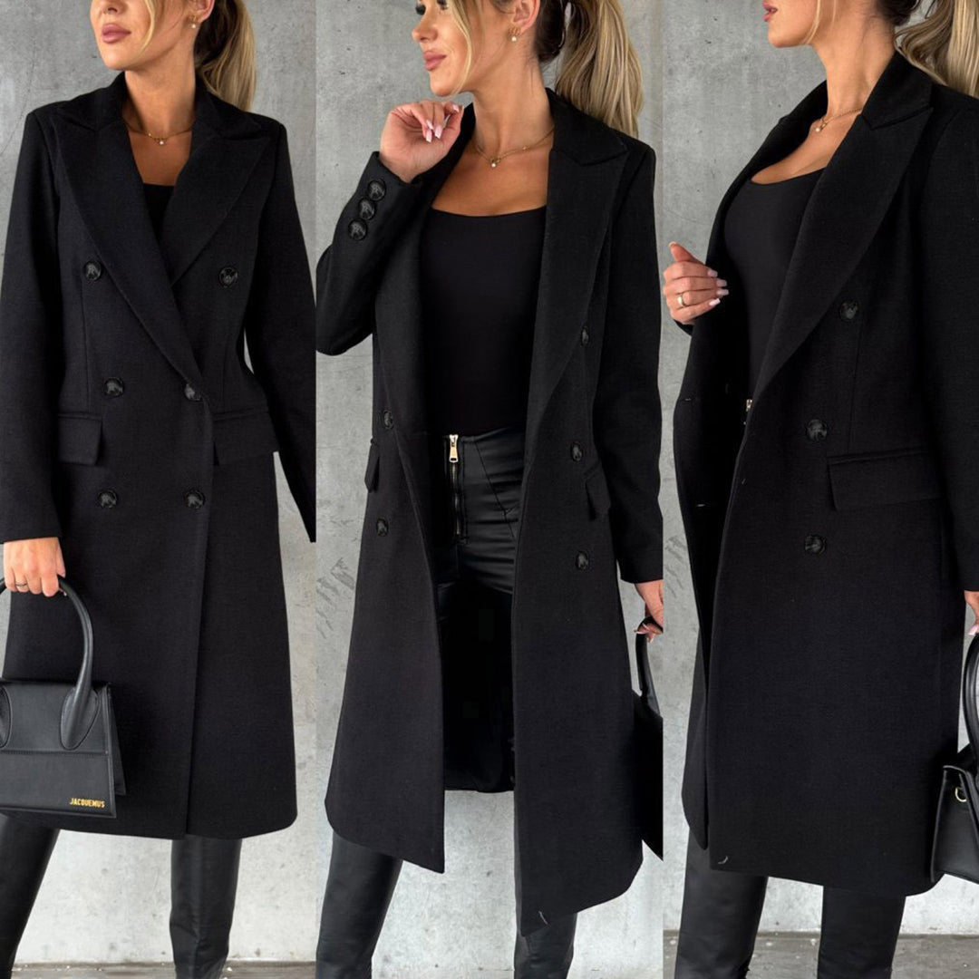 Woman enjoying winter in an Elara coat. Stylish, warm, and elegant outerwear for cold weather fashion.