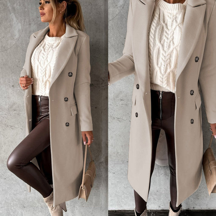 Side view of elegant Elara Women's winter coat, showcasing its long, warm design for cold weather fashion.