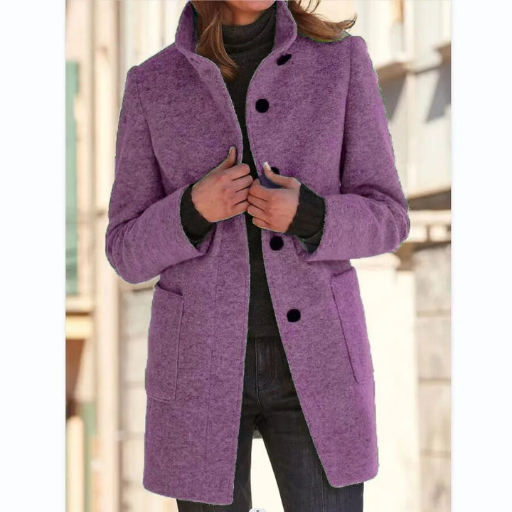 Elegant women's classic winter coat. Stylish buttoned overcoat for a sophisticated fall and winter look.