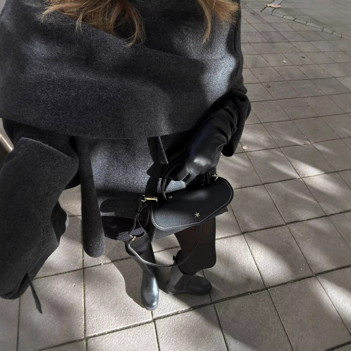Ella women's chic winter poncho, offering effortless warmth & elegant layering style.