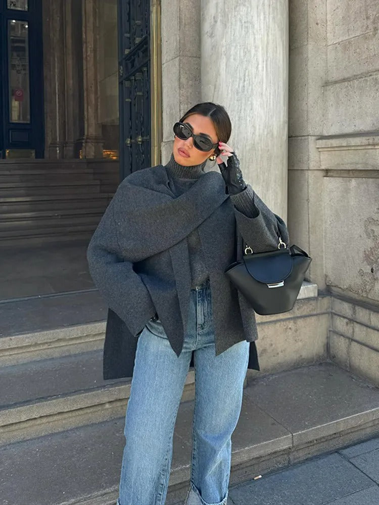 Elegant women's poncho, stylish outerwear for a cozy and warm winter fashion statement.