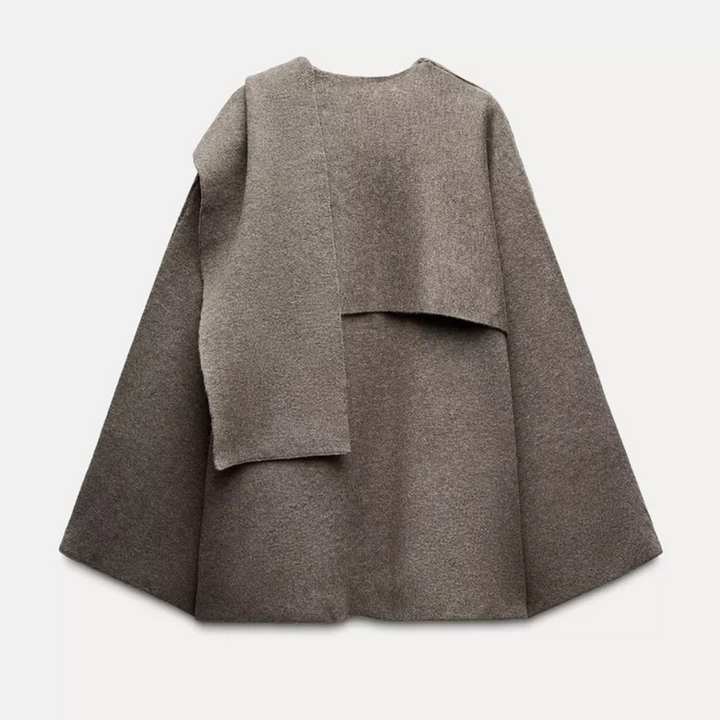 Soft & cozy women's fashion poncho, comfortable winter apparel with a chic asymmetrical design.