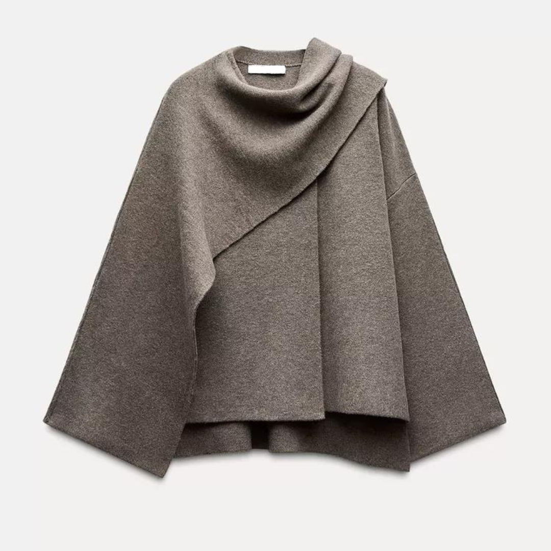 Trendy women's winter poncho, chic asymmetrical design for warm & stylish layering.