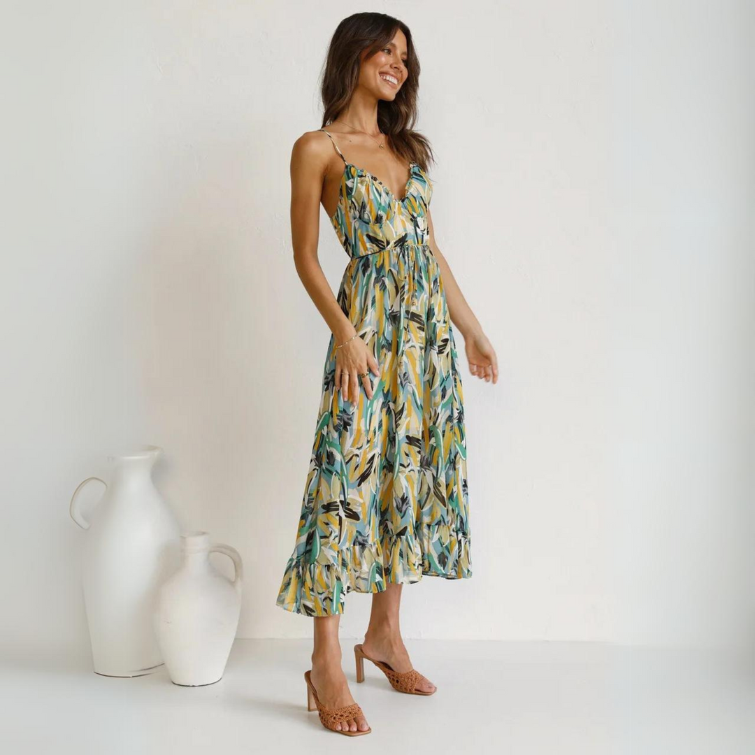 Stylish women's backless midi dress featuring a vivid print, perfect for summer casual wear & vacation.