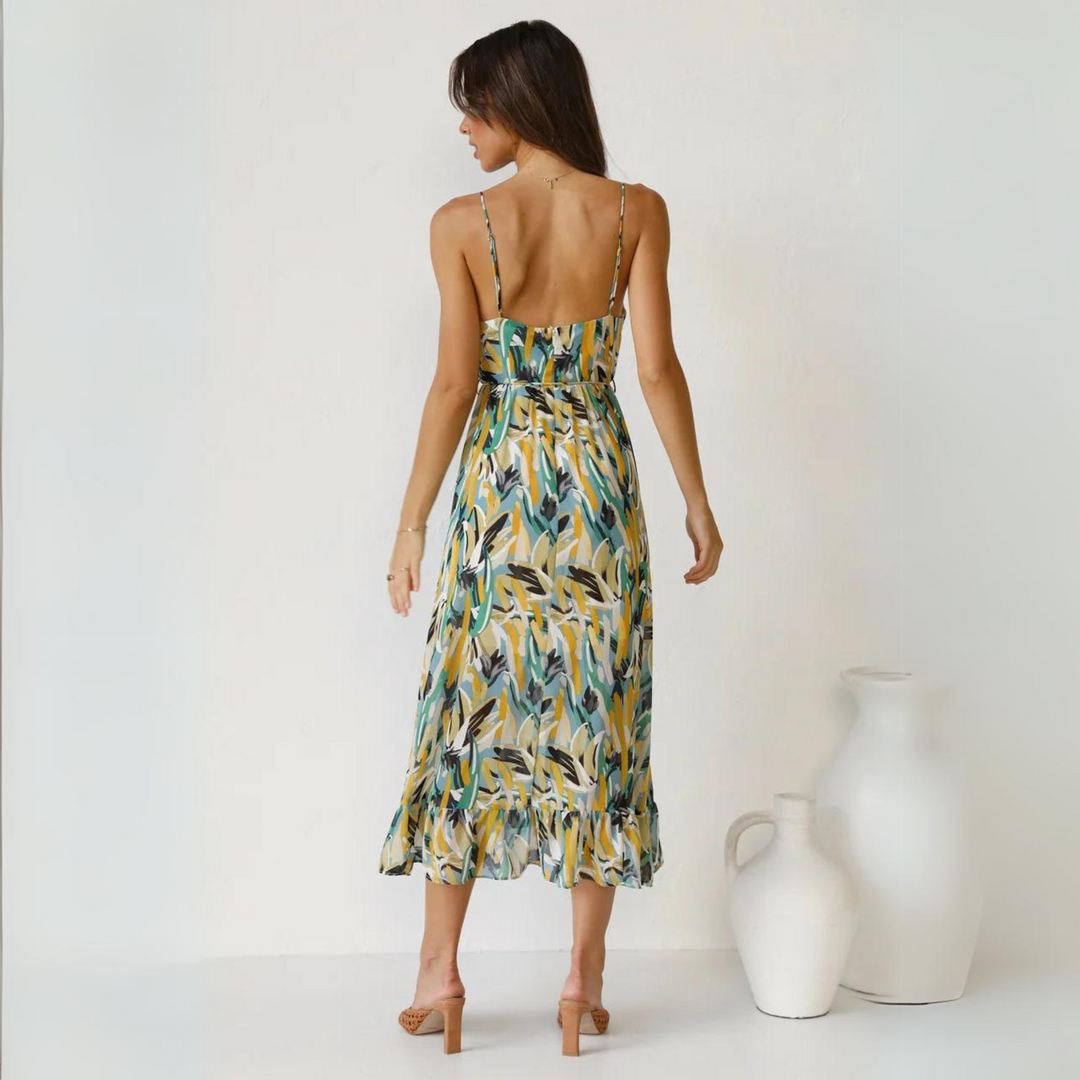 Effortless women's printed summer dress with a flattering backless design. Great for beach or party wear.