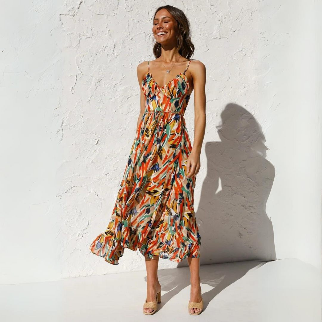 Lightweight sleeveless backless summer dress for women, showcasing a beautiful vibrant print. Casual & comfy.