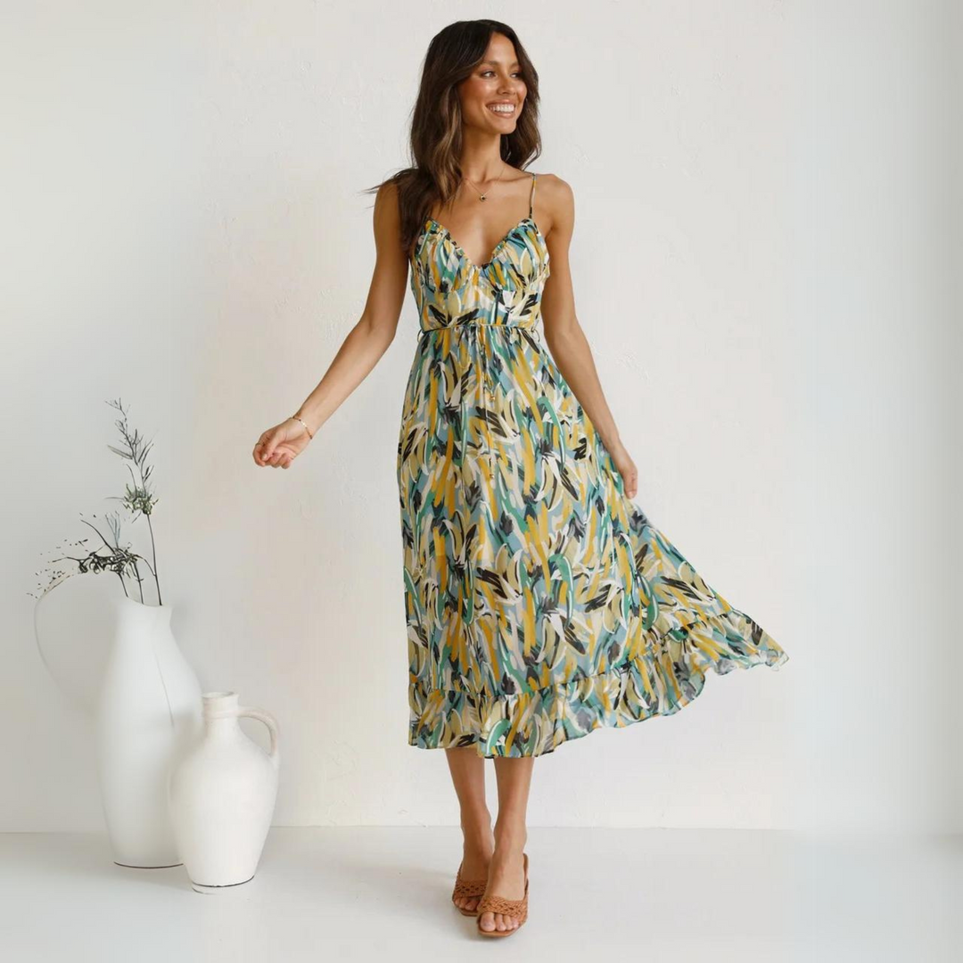 Women's vibrant printed backless summer midi dress, perfect for beach vacations & casual style.