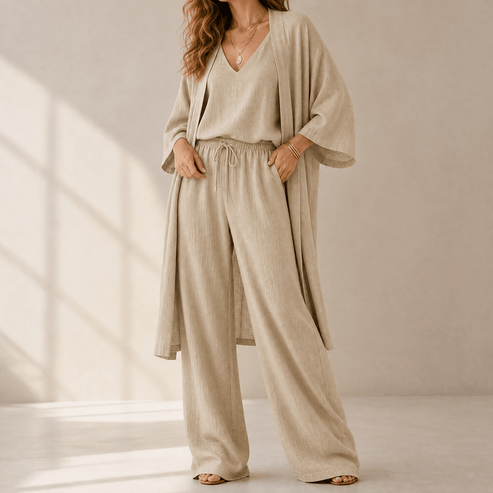 Women's cozy 3-piece loungewear set. Includes wide leg pants, duster cardigan & cami for ultimate comfort.