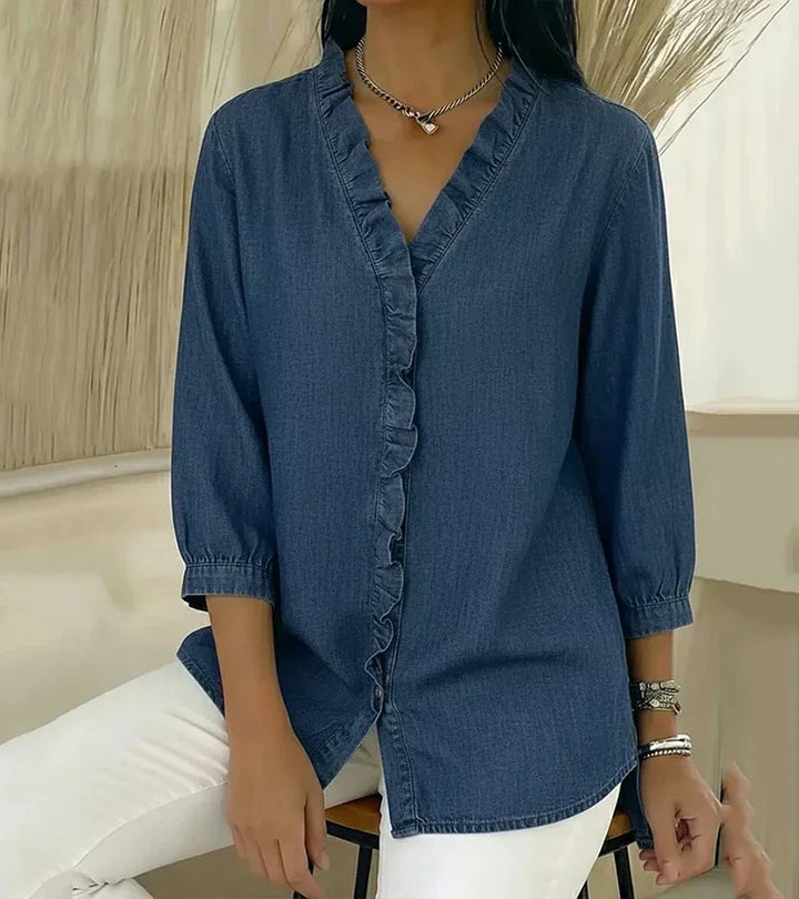 Stylish women's flowy blouse featuring a V-neck and delicate ruffles, ideal for casual elegance.