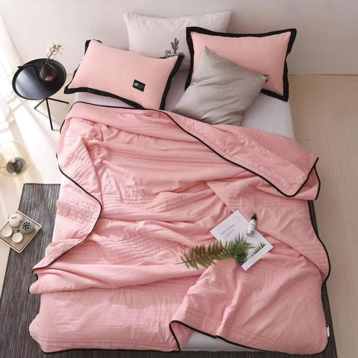 Experience cool comfort with this unisex summer blanket, engineered for temperature regulating sleep.