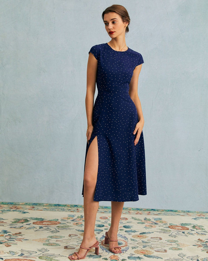 Chic navy blue polka dot midi dress for women, with elegant cut-outs and comfortable cap sleeves.