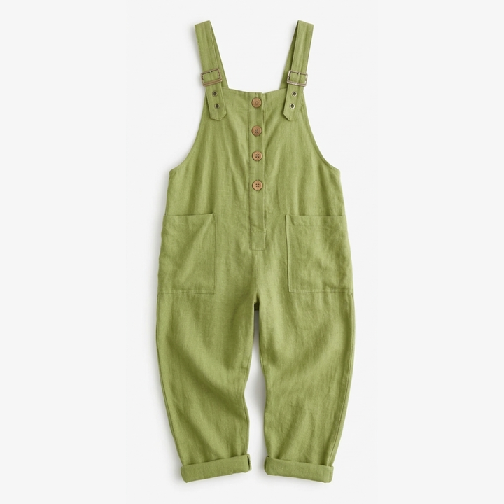 Detail of Thessaly women's relaxed fit bib overall jumpsuit fabric, showing comfortable wide leg design.