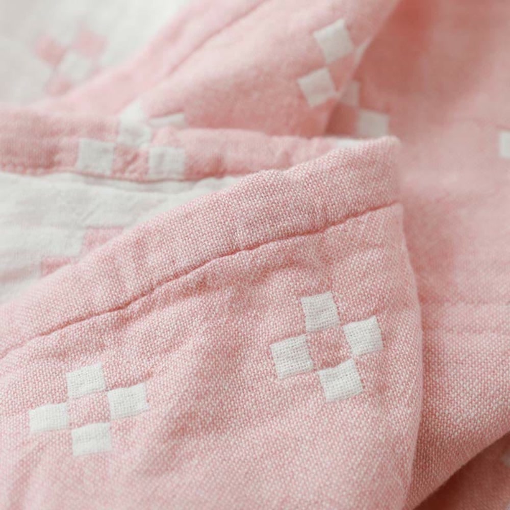 Stylish geometric cotton blanket, soft, breathable & lightweight, excellent for all-season home comfort.