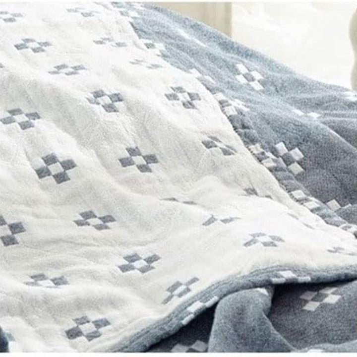 Cozy geometric cotton throw for living rooms or bedrooms, soft, fluffy, and aesthetically pleasing.