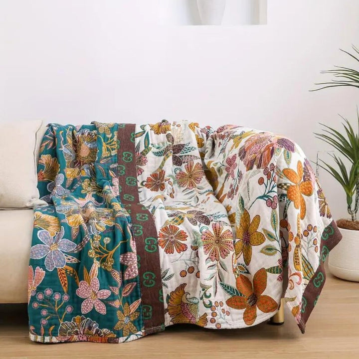 Soft, cozy cotton floral throw blanket, reversible design, perfect for all-season home accent & decor.