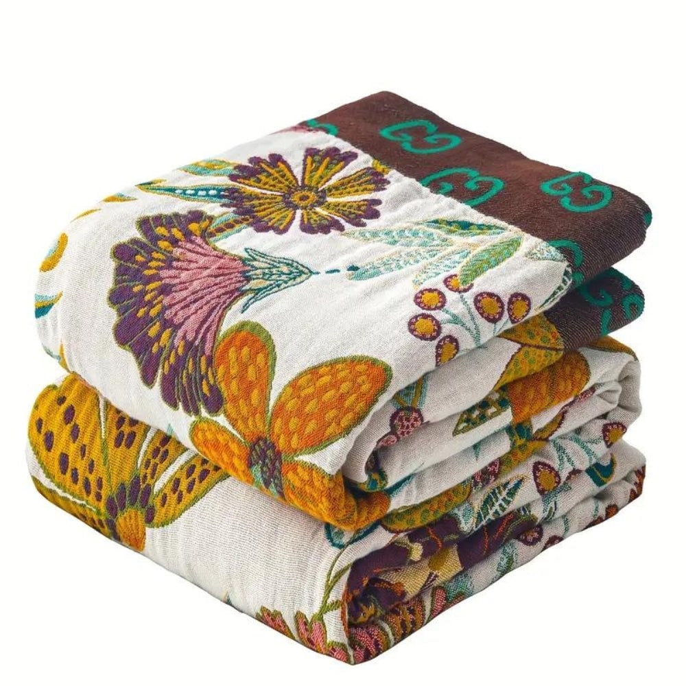 Beautiful floral patterned reversible cotton throw blanket, soft, elegant & cozy for home accent.