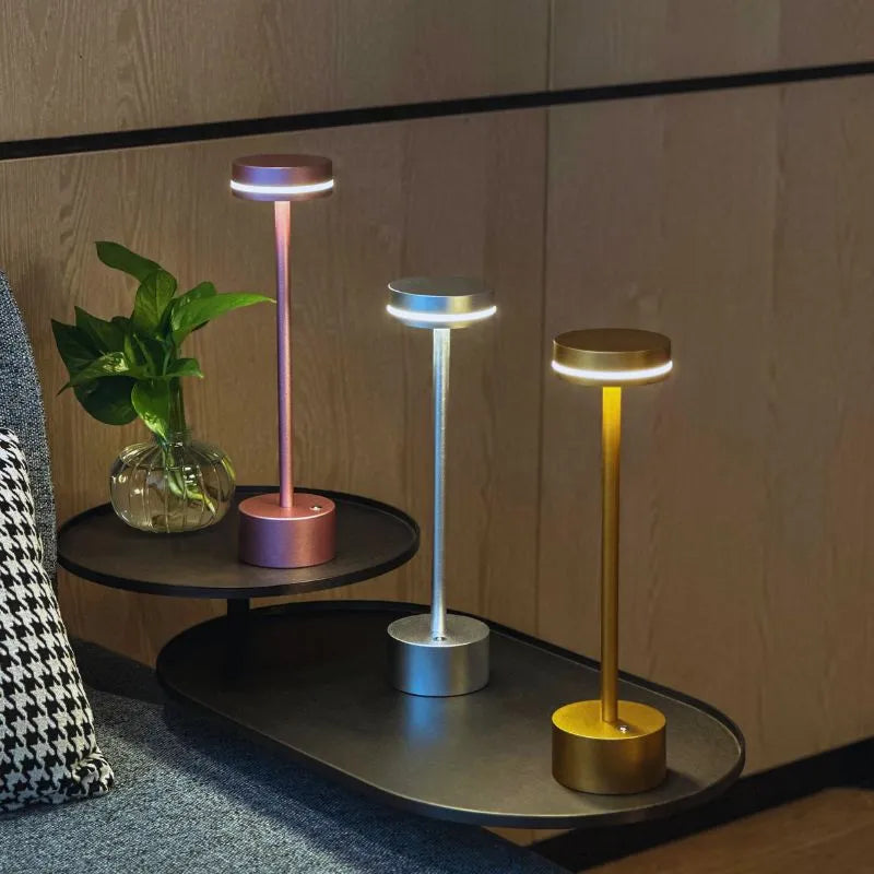 Versatile cordless LED table lamp with touch control, providing adjustable, soft lighting for reading.