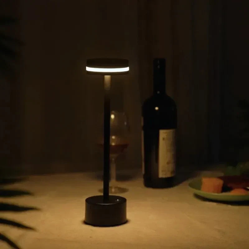 Stylish rechargeable table lamp, LED lit and touch dimmable, a perfect modern accent for living spaces.