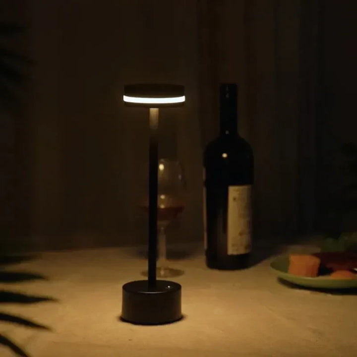 Stylish rechargeable table lamp, LED lit and touch dimmable, a perfect modern accent for living spaces.
