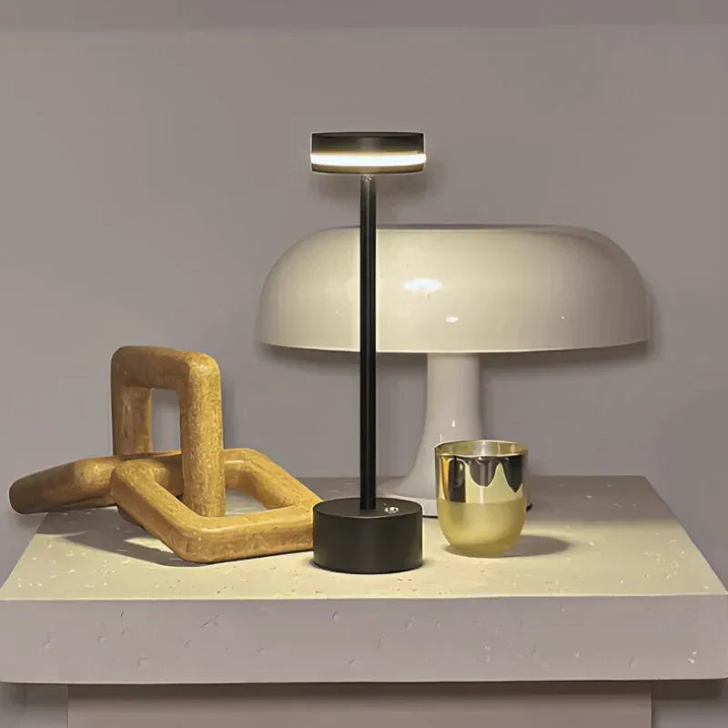 Practical portable LED table lamp, rechargeable & touch dimmable, ideal for bedside or desk lighting.